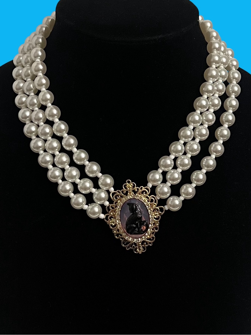Betsey Johnson Pearl Triple Strand Cameo Necklace in White and Gold
